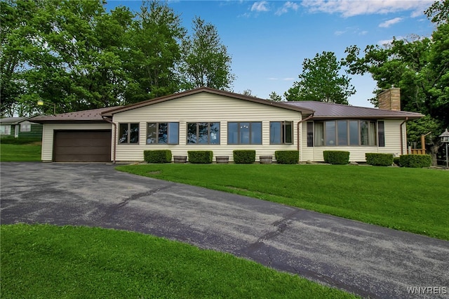 3955 Four Rod Rd Unit S, Marilla, NY 14052 - ranch-style home with asphalt driveway, a garage, a front yard, a chimney, and metal roof