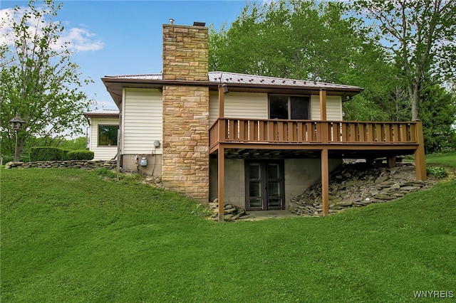 3955 Four Rod Rd Unit S, Marilla, NY 14052 - rear view of house featuring a wooden deck, a chimney, a lawn, and metal roof