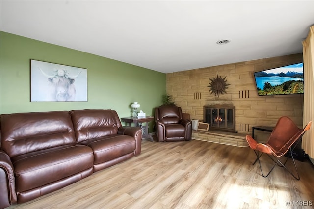 3955 Four Rod Rd Unit S, Marilla, NY 14052 - living area with wood finished floors and a large fireplace