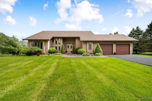 5 Byron Ln, Kirkland, NY 13323 - view of front of property with a garage, a front lawn, and driveway