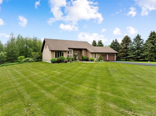5 Byron Ln, Kirkland, NY 13323 - view of front of property featuring a garage, asphalt driveway, and a front yard
