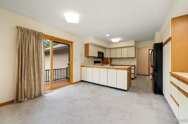 5 Byron Ln, Kirkland, NY 13323 - kitchen with black appliances, a peninsula, light countertops, and baseboards