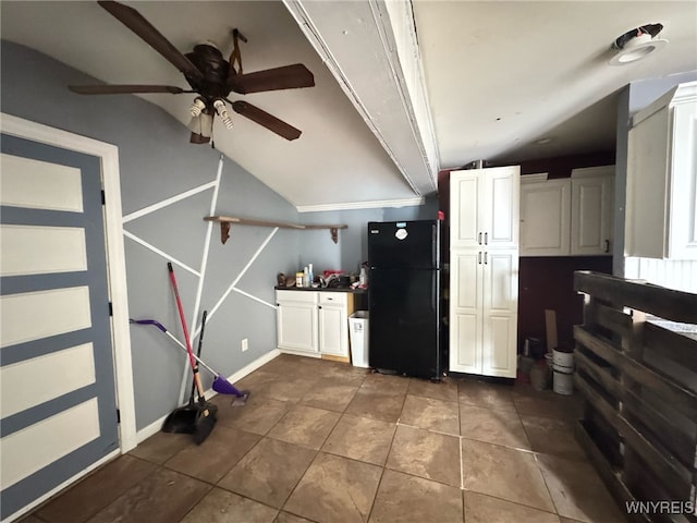 7 High St, Lyons, NY 14489 - kitchen featuring freestanding refrigerator, ceiling fan, dark tile patterned floors, and white cabinetry