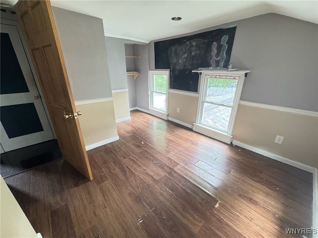 7 High St, Lyons, NY 14489 - spare room with wood finished floors, lofted ceiling, and baseboards