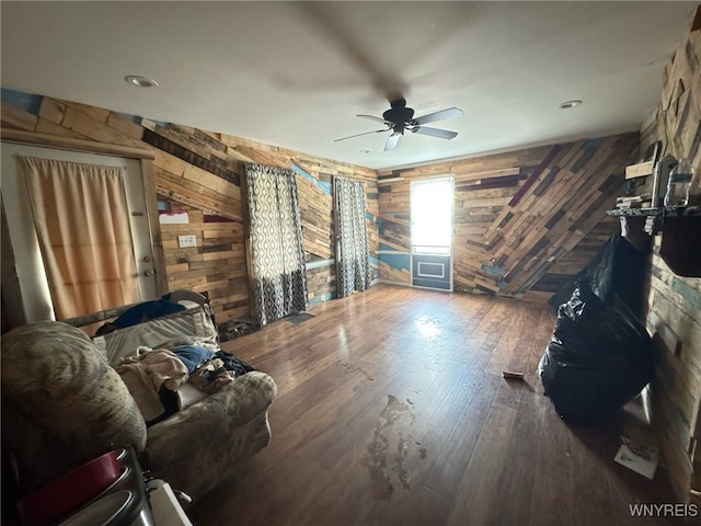 7 High St, Lyons, NY 14489 - living area with wooden walls, ceiling fan, and hardwood / wood-style flooring