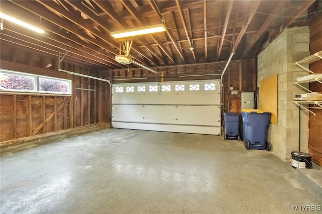 69 Coolidge Ave, Lockport-City, NY 14094 - garage featuring a garage door opener