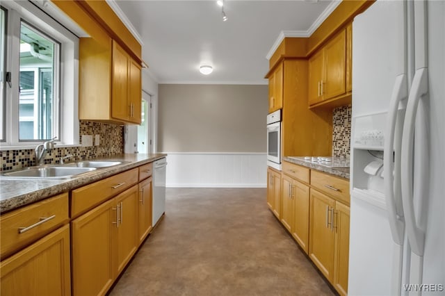 69 Coolidge Ave, Lockport-City, NY 14094 - kitchen with white appliances, a sink, crown molding, backsplash, and a wainscoted wall