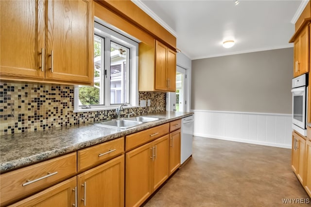 69 Coolidge Ave, Lockport-City, NY 14094 - kitchen with a sink, white appliances, ornamental molding, backsplash, and a wainscoted wall