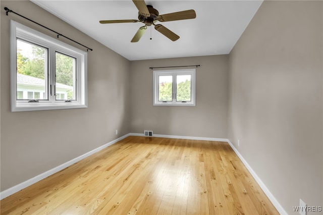 69 Coolidge Ave, Lockport-City, NY 14094 - unfurnished room with baseboards, wood-type flooring, and a ceiling fan