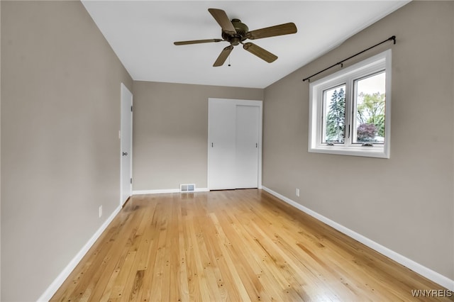 69 Coolidge Ave, Lockport-City, NY 14094 - unfurnished bedroom featuring hardwood / wood-style flooring, baseboards, a closet, and ceiling fan