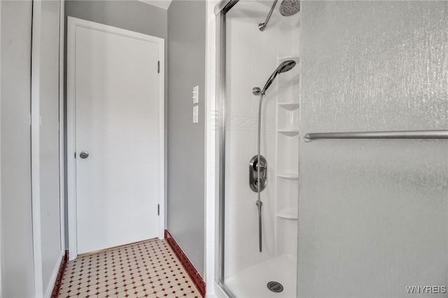 69 Coolidge Ave, Lockport-City, NY 14094 - full bathroom featuring a shower stall, baseboards, and tile patterned floors