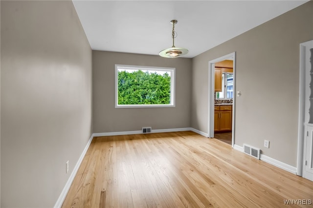 69 Coolidge Ave, Lockport-City, NY 14094 - unfurnished room with light wood finished floors and baseboards