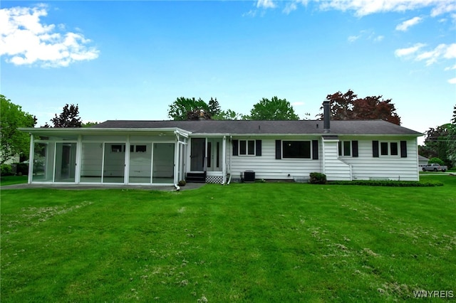 69 Coolidge Ave, Lockport-City, NY 14094 - rear view of house featuring a sunroom, a yard, entry steps, and central air condition unit