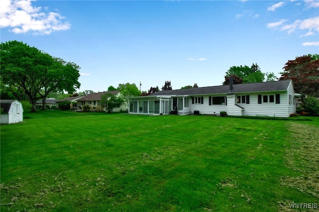 69 Coolidge Ave, Lockport-City, NY 14094 - rear view of property featuring a lawn and a sunroom