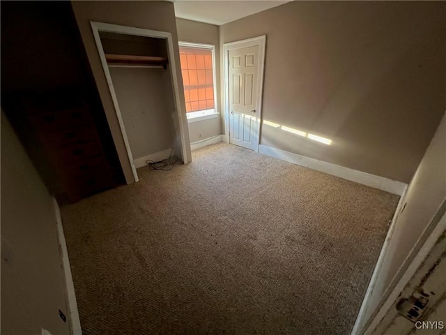 2817 Brighton Pl, Utica, NY 13501 - unfurnished bedroom featuring carpet floors, baseboards, and a closet