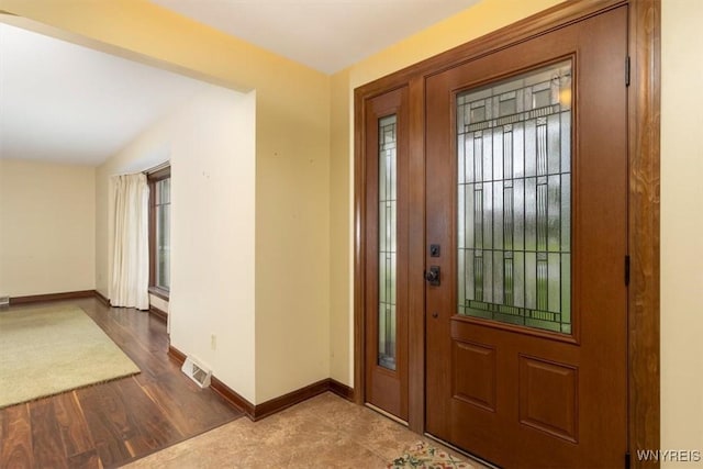 23 Bittersweet Ln, Orchard Park, NY 14127 - entrance foyer featuring baseboards, healthy amount of natural light, and wood finished floors
