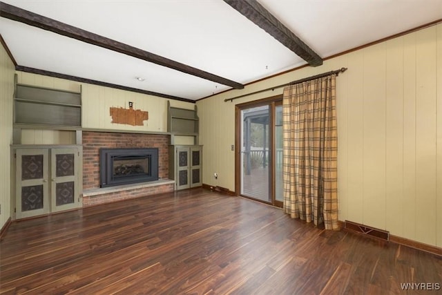 23 Bittersweet Ln, Orchard Park, NY 14127 - unfurnished living room featuring beam ceiling, wood finished floors, a brick fireplace, baseboards, and ornamental molding