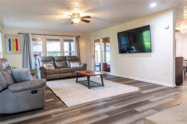 4335 US Route 11, Richland, NY 13142 - living room with ceiling fan, baseboards, dark wood-type flooring, a textured ceiling, and recessed lighting