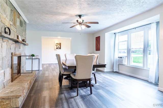 4335 US Route 11, Richland, NY 13142 - dining space with dark wood finished floors, a textured ceiling, a ceiling fan, baseboards, and cooling unit