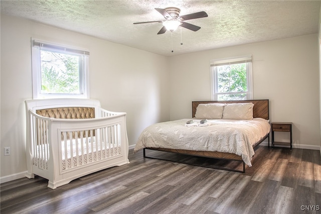 4335 US Route 11, Richland, NY 13142 - bedroom with wood finished floors, a textured ceiling, baseboards, and a ceiling fan