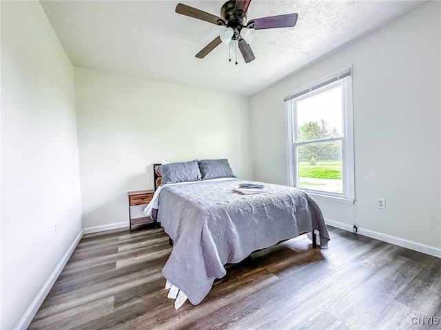 4335 US Route 11, Richland, NY 13142 - bedroom featuring baseboards, dark wood finished floors, and a ceiling fan