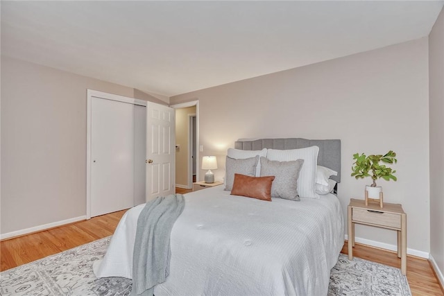 1 Ashton Dr, Gates, NY 14624 - bedroom with wood finished floors, baseboards, and a closet