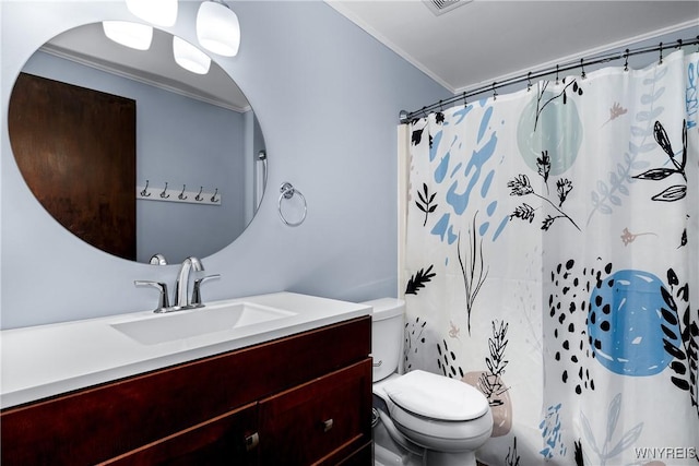 3898 Ridge Lea Rd Unit B, Amherst, NY 14228 - bathroom with toilet, vanity, crown molding, and a shower with curtain