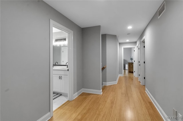 110 Hunt Club Cir, Amherst, NY 14051 - hall with light wood-style floors, recessed lighting, an upstairs landing, and baseboards
