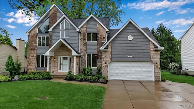 110 Hunt Club Cir, Amherst, NY 14051 - craftsman-style home with a front lawn, driveway, a garage, and brick siding