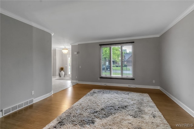 110 Hunt Club Cir, Amherst, NY 14051 - spare room with crown molding, wood finished floors, and baseboards
