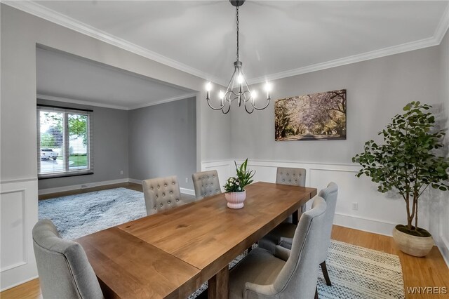 110 Hunt Club Cir, Amherst, NY 14051 - dining space featuring a chandelier, wood finished floors, and crown molding