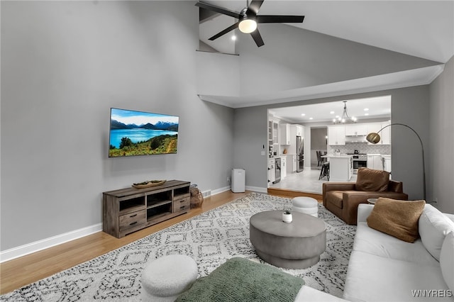 110 Hunt Club Cir, Amherst, NY 14051 - living room featuring a chandelier, light wood-type flooring, recessed lighting, baseboards, and a ceiling fan