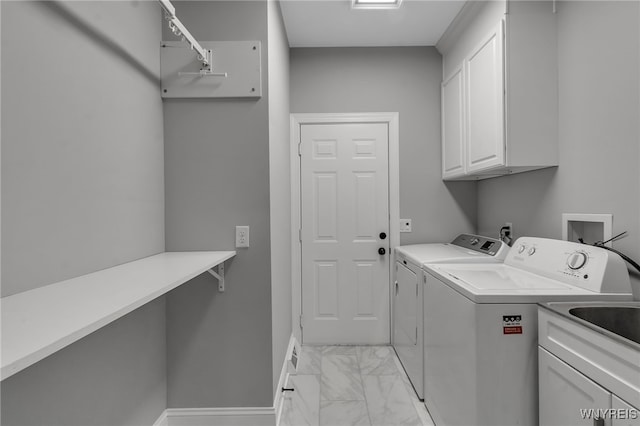 110 Hunt Club Cir, Amherst, NY 14051 - laundry room featuring cabinet space, separate washer and dryer, baseboards, and light marble finish flooring