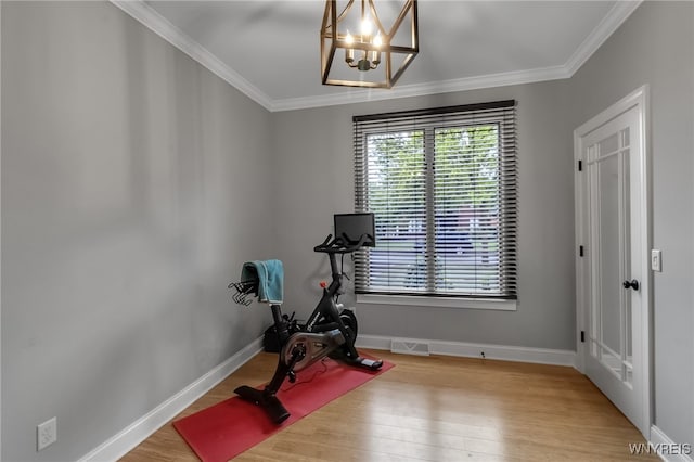 110 Hunt Club Cir, Amherst, NY 14051 - workout area featuring a chandelier, wood finished floors, ornamental molding, and baseboards