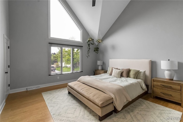 110 Hunt Club Cir, Amherst, NY 14051 - bedroom featuring wood finished floors, vaulted ceiling, and baseboards