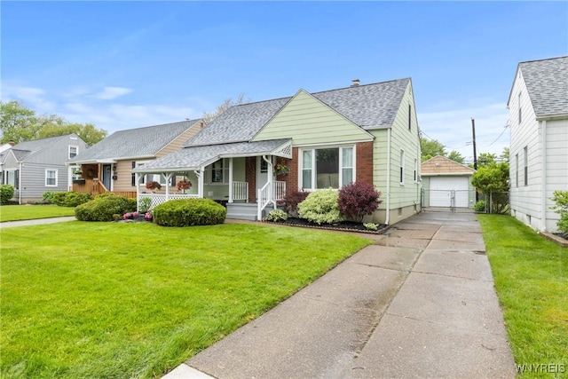 234 Clark St, Tonawanda-Town, NY 14223 - bungalow-style home featuring covered porch, a shingled roof, a front lawn, and an outdoor structure