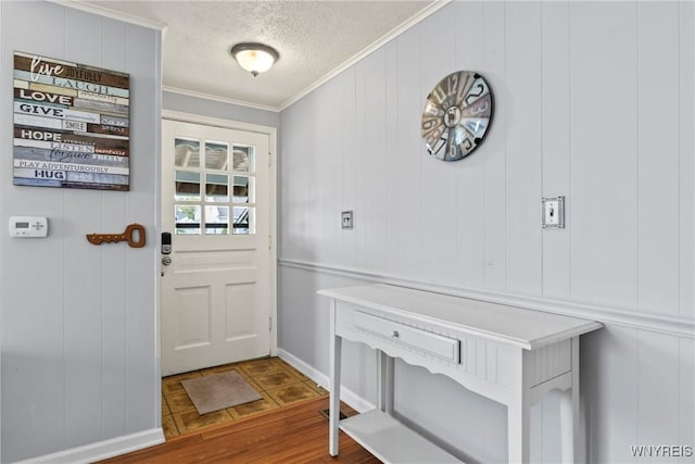 234 Clark St, Tonawanda-Town, NY 14223 - doorway to outside featuring a textured ceiling, crown molding, and wood finished floors