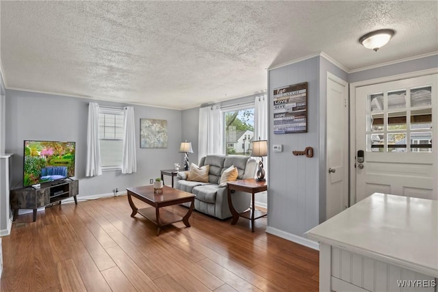 234 Clark St, Tonawanda-Town, NY 14223 - living area with baseboards, a textured ceiling, dark wood-style flooring, and ornamental molding