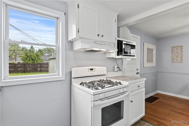 234 Clark St, Tonawanda-Town, NY 14223 - kitchen with gas range gas stove, under cabinet range hood, white cabinets, light countertops, and dark wood-type flooring