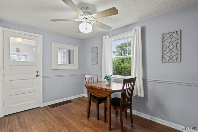 234 Clark St, Tonawanda-Town, NY 14223 - dining room featuring baseboards, wood finished floors, a textured ceiling, and a ceiling fan