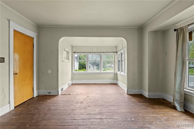 22 Bruce St, Buffalo, NY 14214 - empty room with arched walkways, hardwood / wood-style floors, ornamental molding, and baseboards