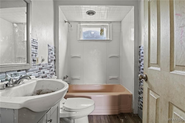 22 Bruce St, Buffalo, NY 14214 - full bathroom with wood finished floors, vanity, toilet, and bathing tub / shower combination