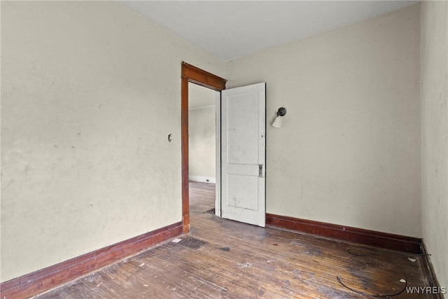 22 Bruce St, Buffalo, NY 14214 - empty room with wood-type flooring and baseboards