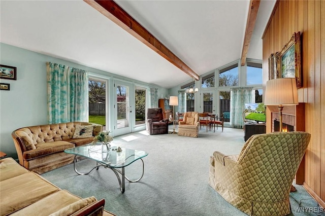 149 Fleetwood Ter, Amherst, NY 14221 - carpeted living area with french doors and a lit fireplace