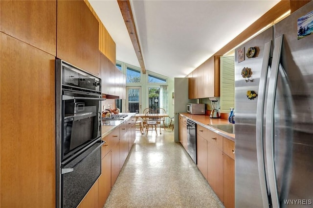 149 Fleetwood Ter, Amherst, NY 14221 - kitchen featuring black appliances, light countertops, and a sink