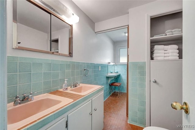 149 Fleetwood Ter, Amherst, NY 14221 - full bathroom with tile walls, tile patterned floors, double vanity, and wainscoting