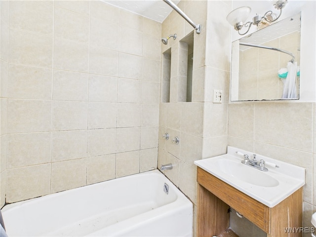 1307 Michigan Ave, Niagara Falls, NY 14305 - bathroom featuring tile walls, bathtub / shower combination, vanity, and toilet