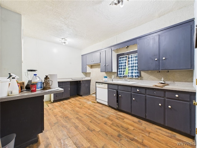 1307 Michigan Ave, Niagara Falls, NY 14305 - kitchen featuring white dishwasher, light wood-type flooring, a textured ceiling, a sink, and light countertops