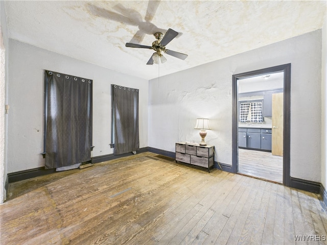 1307 Michigan Ave, Niagara Falls, NY 14305 - empty room with hardwood / wood-style flooring, ceiling fan, and baseboards
