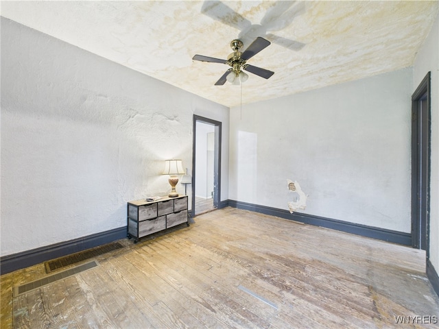 1307 Michigan Ave, Niagara Falls, NY 14305 - spare room featuring hardwood / wood-style floors, a ceiling fan, and baseboards